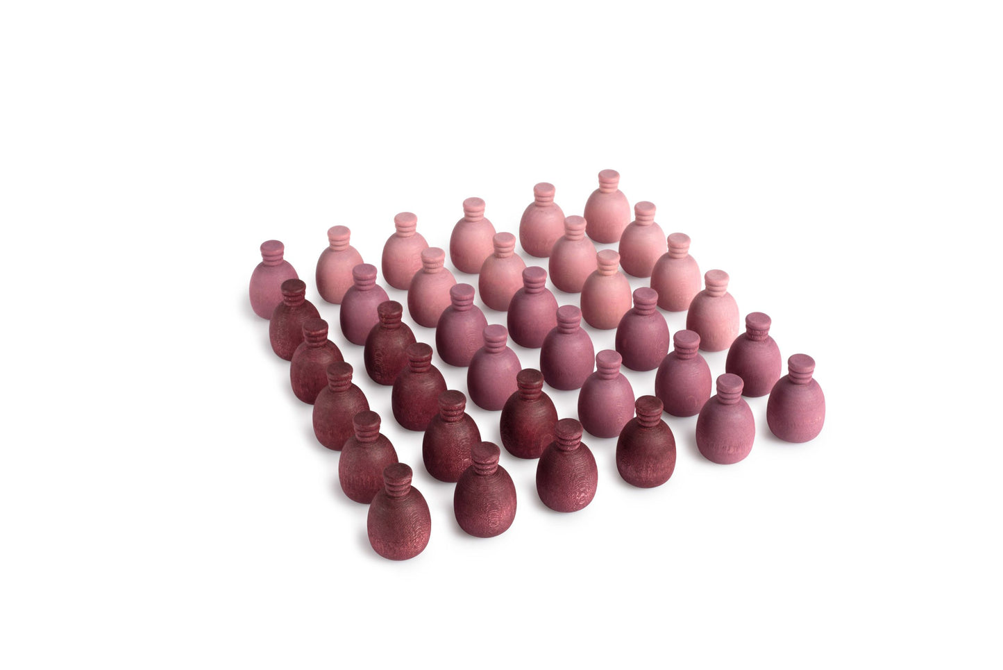 Wooden mandala pieces shaped like pineapples.  They are various shades of purple.